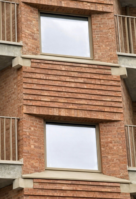 Residential building facade showing windows where water leaking from window frames may require inspection and remedial work.